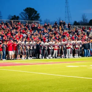 Crowd cheering at the Fightin' Tigers football game with players on the field.