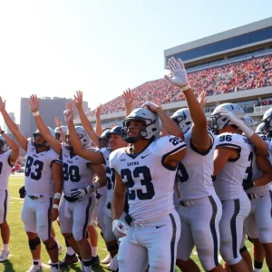 A college football team celebrates a victory in a stadium.