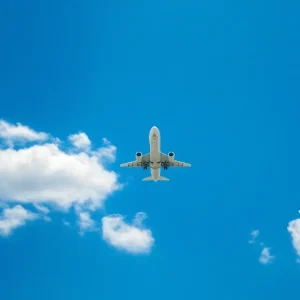 An airplane taking off against a clear sky